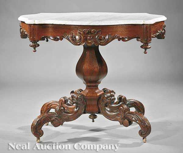 Appraisal: An American Rococo Carved Rosewood and Rosewood-Grained Parlor Table mid-