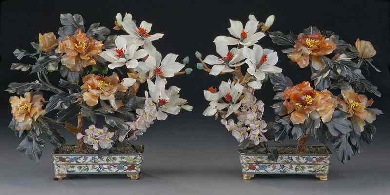 Appraisal: Pr Chinese carved jade treesdepicting peony and magnolia blossoms raised