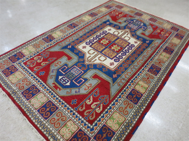 Appraisal: HAND KNOTTED ORIENTAL CARPET Indo-Kazak central geometric medallion and curvilinear