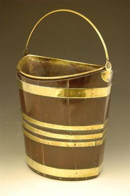 Appraisal: A George III mahogany and brass bound peat bucket of