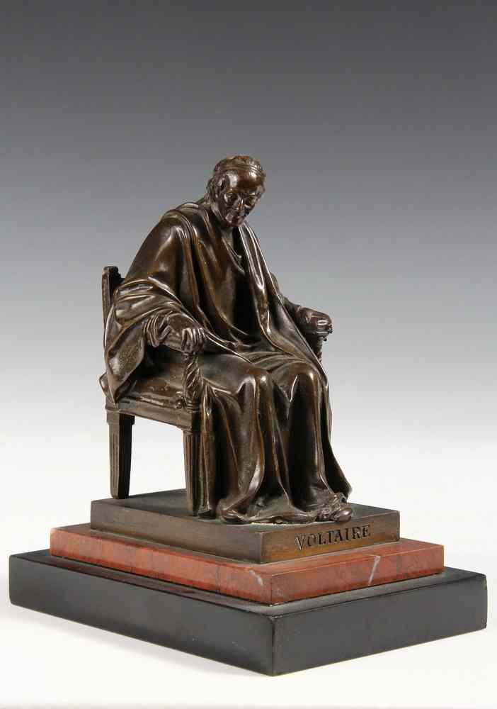 Appraisal: A BRONZE STATUETTE OF VOLTAIRE SEATED BY JEAN-ANTOINE HOUDON -