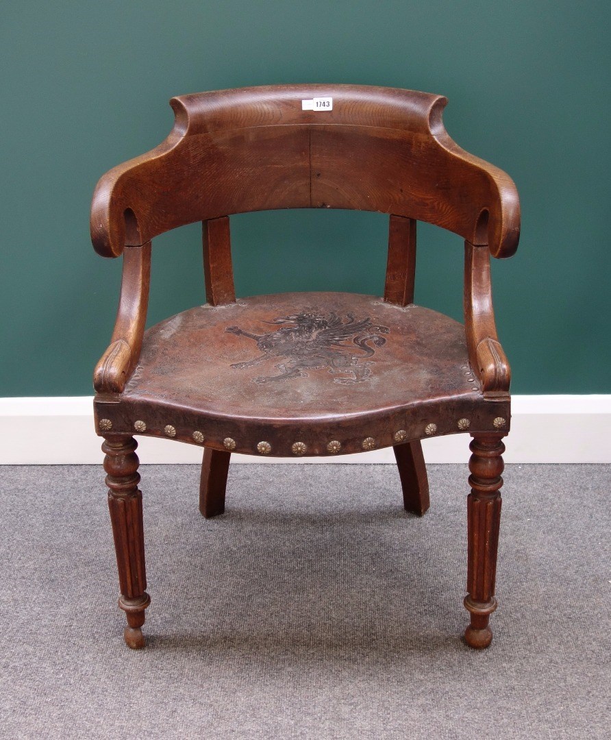 Appraisal: A th century French oak tub back chair with studded