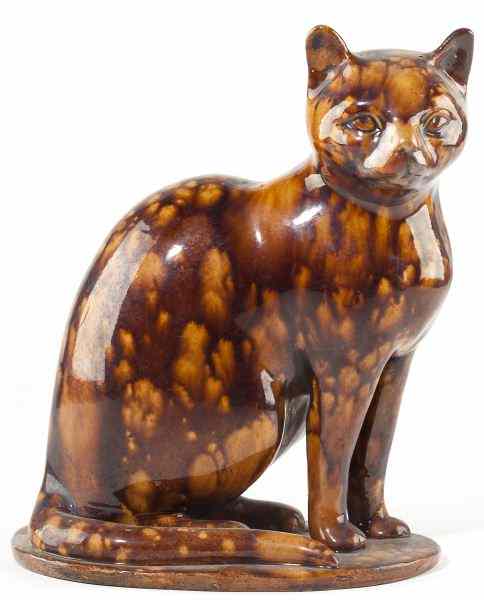 Appraisal: Rockingham Type Seated Cat th century large feline figure with