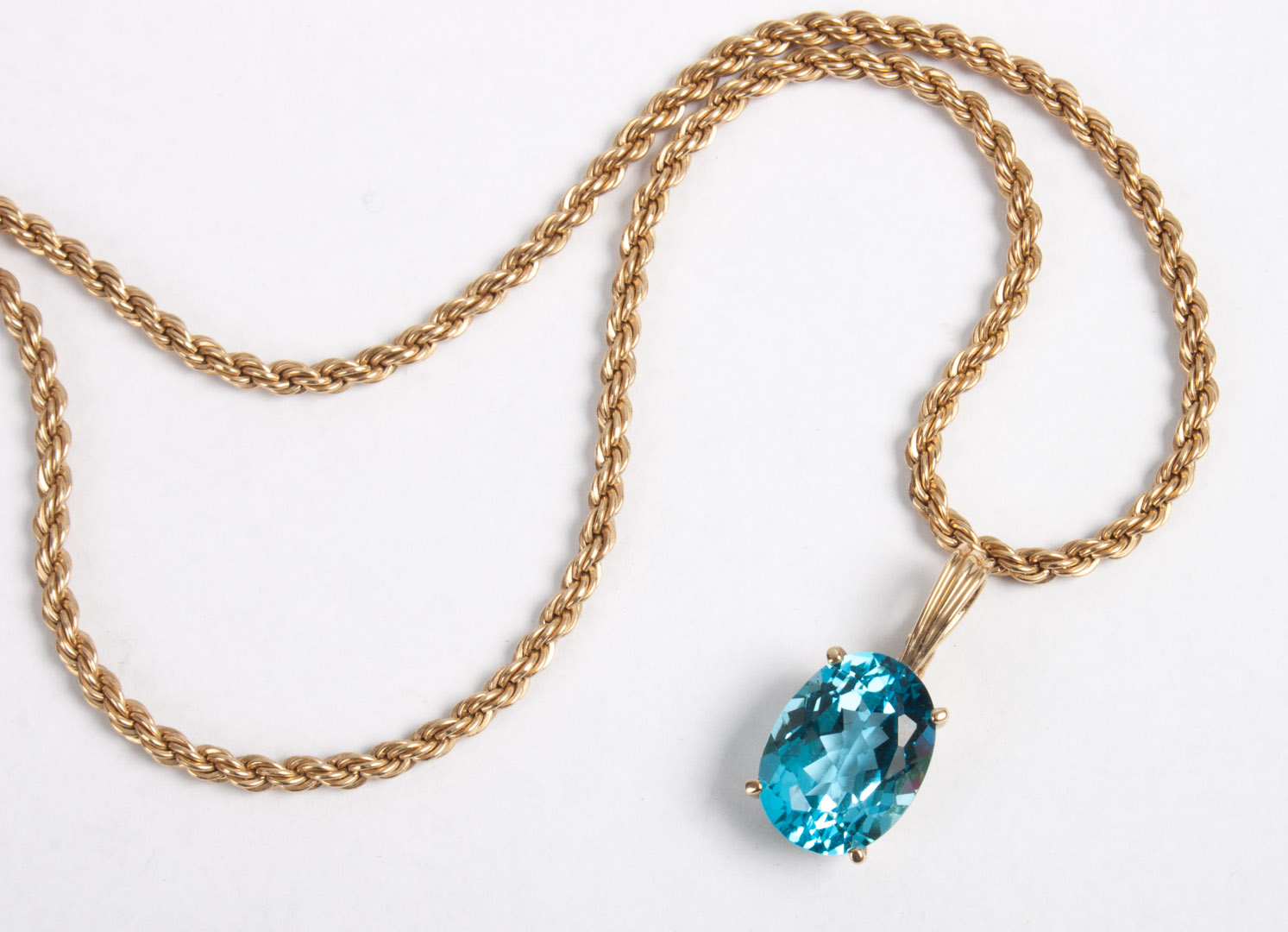 Appraisal: K gold blue topaz pendant K gold rope chain K