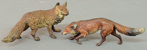 Appraisal: - Two cold painted Austrian bronze foxes largest h x