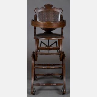 Appraisal: A Victorian Walnut Transforming Doll's Rolling High Chair and Stroller