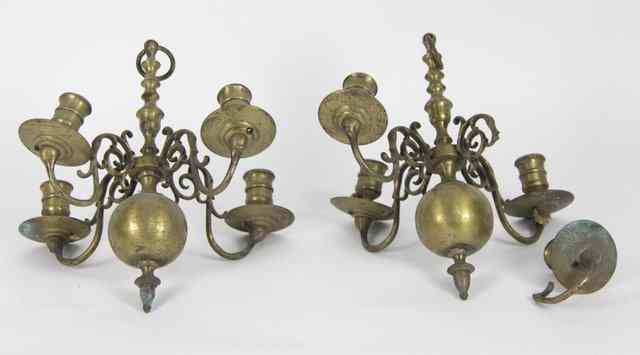 Appraisal: A pair of Dutch brass four-light electroliers with scroll branches