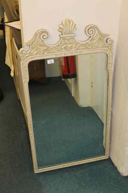 Appraisal: A GEORGE III STYLE WHITE AND GILT PAINTED MIRROR with