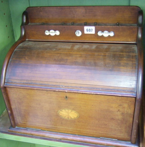 Appraisal: An Edwardian mahogany writing slope modelled as a roll top