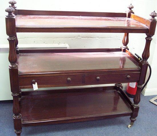 Appraisal: A Victorian mahogany buffet the three tiers united by bulbous