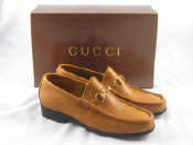 Appraisal: A pair of Gucci tan leather loafer shoes size C