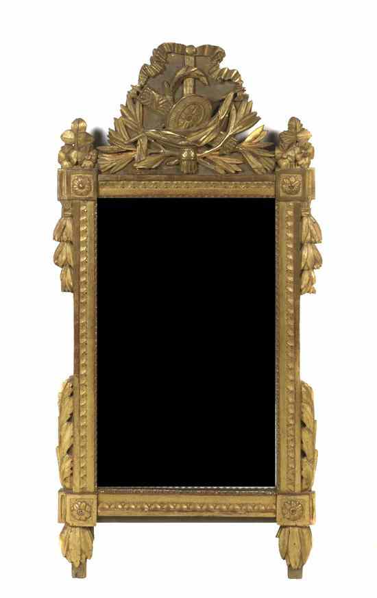 Appraisal: A Neoclassical Giltwood Mirror having an ax and shield trophy