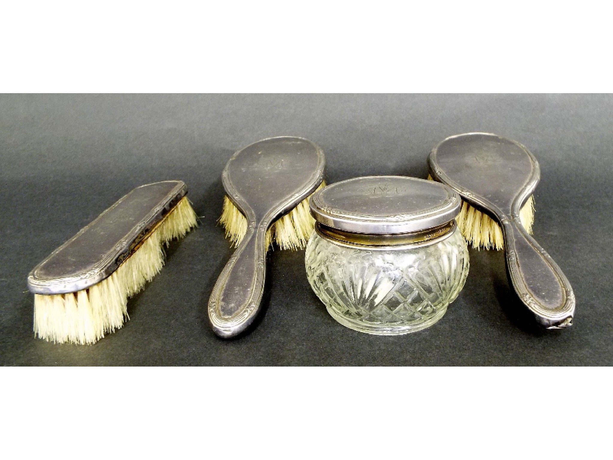 Appraisal: Early th century four piece dressing set comprising three brushes