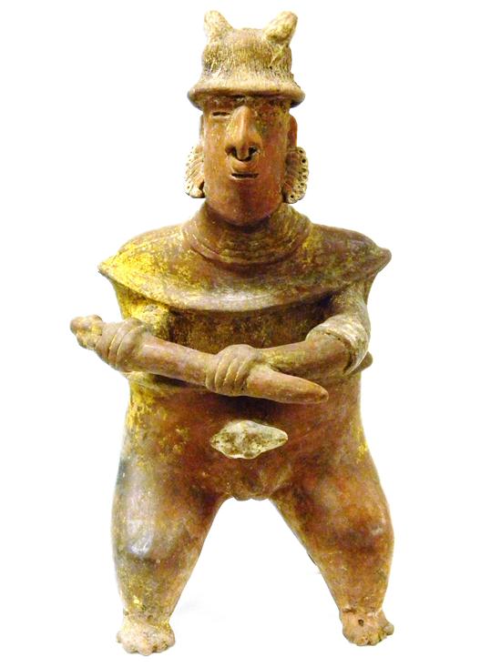 Appraisal: Pre-Columbian red clay kneeling figure holding baton wears eared hat