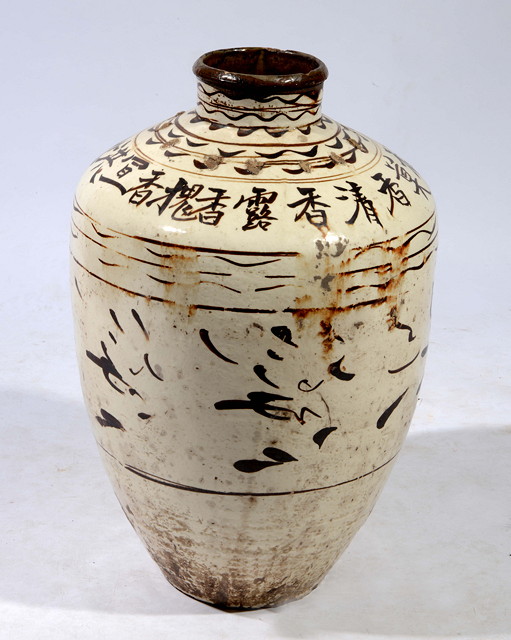 Appraisal: A LARGE CHINESE CIZHOU-STYLE STORAGE JAR decorated to the ovoid