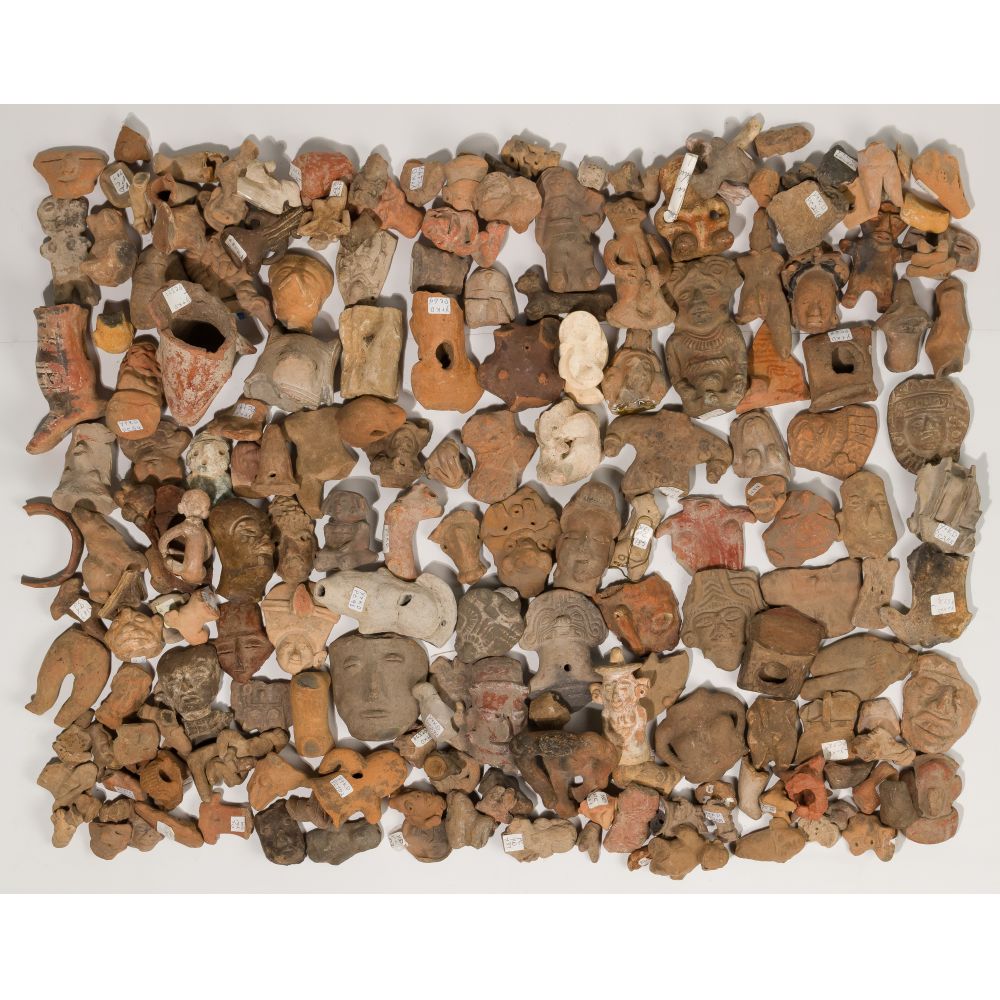 Appraisal: PRE-COLUMBIAN FIGURINE FRAGMENTSOver pounds of fragments including heads faces and