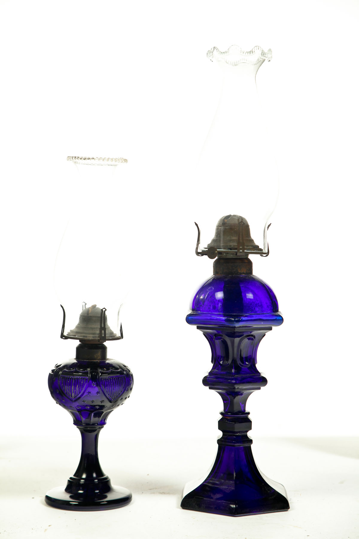 Appraisal: TWO COBALT OIL LAMPS American late th century Shield and