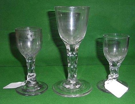 Appraisal: AN ANTIQUE DRINKING GLASS with faceted stem and etched grape