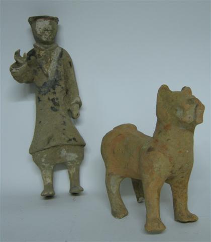 Appraisal: Two Chinese terracotta figures Intact long-torso groom figure with raised