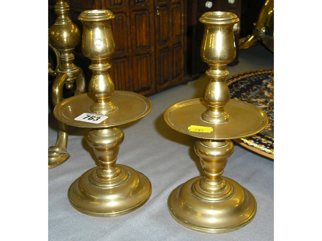 Appraisal: Pair of th century style brass candlesticks with turned stems