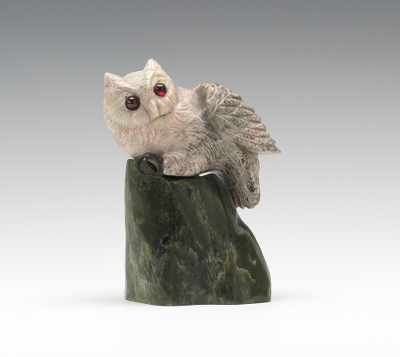 Appraisal: A Carved Stone Owl on a Rock Realistically carved and