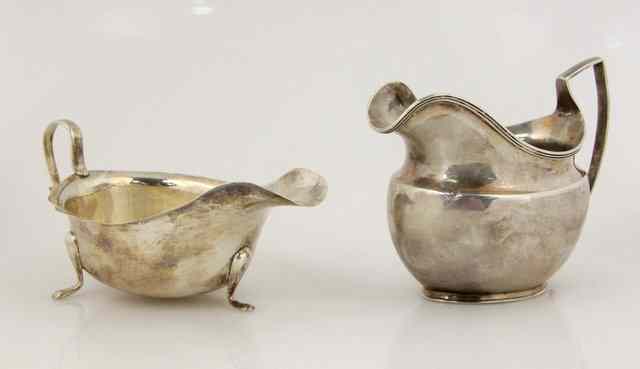 Appraisal: A George III silver cream jug TL Sheffield of helmet