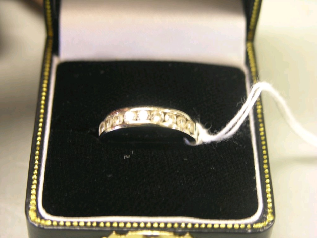 Appraisal: An ct white gold and diamond ring set nine small