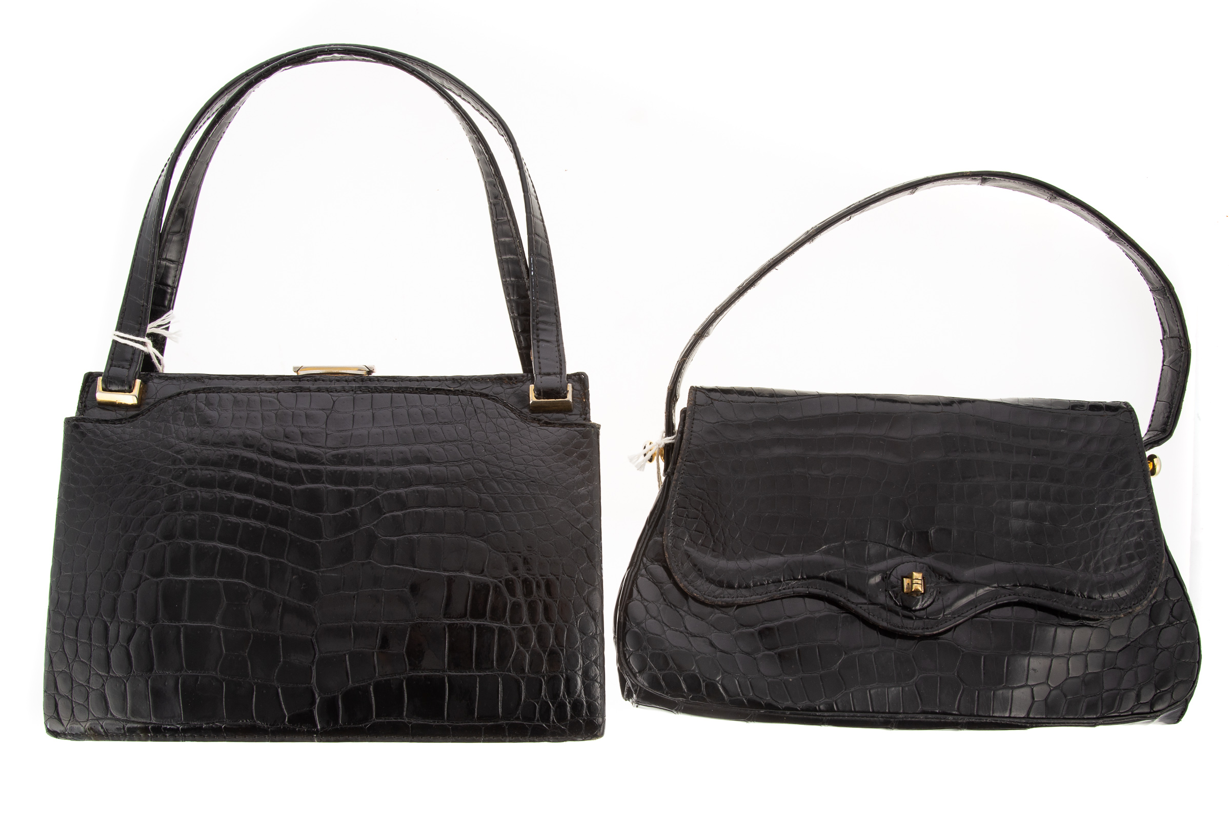 Appraisal: TWO BLACK ALLIGATOR AND CROCODILE HANDBAGS largest is in H