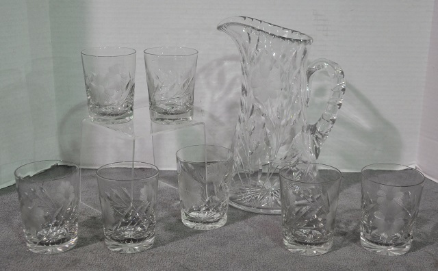 Appraisal: Cut Glass Water SetWith pitcher and seven tumblers one with