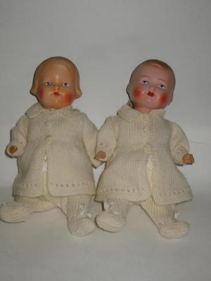 Appraisal: A pair of composition boy and girl twin dolls each