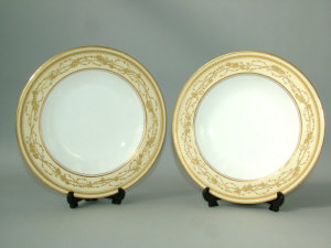 Appraisal: A Wedgwood yellow ground and gilded dinner service comprising dinner