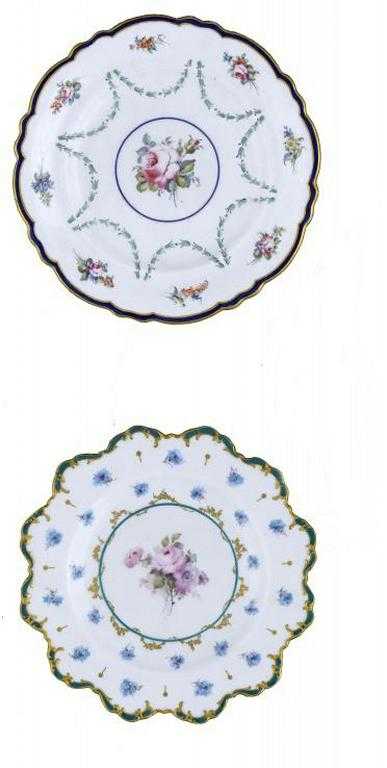 Appraisal: TWO ROYAL CROWN DERBY PLATES painted with a central group