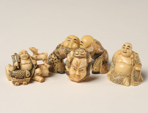 Appraisal: Japanese carved netsukes buddha figures and wrestlers some ivory Tallest