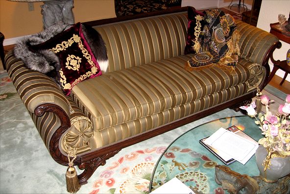 Appraisal: AMERICAN EMPIRE CARVED MAHOGANY SOFA Straight top rail with scroll