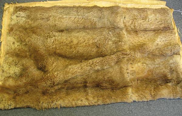 Appraisal: A pair of fur throws and a pillow