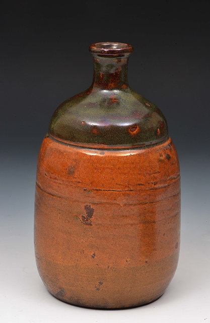 Appraisal: A Japanese tokkuriEarly th Centuryof tapering form with simple glaze