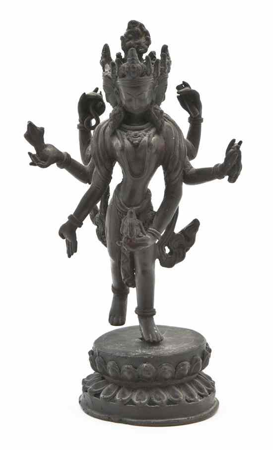 Appraisal: An Indian Bronze Figure of a Multi-Armed Deity the figure