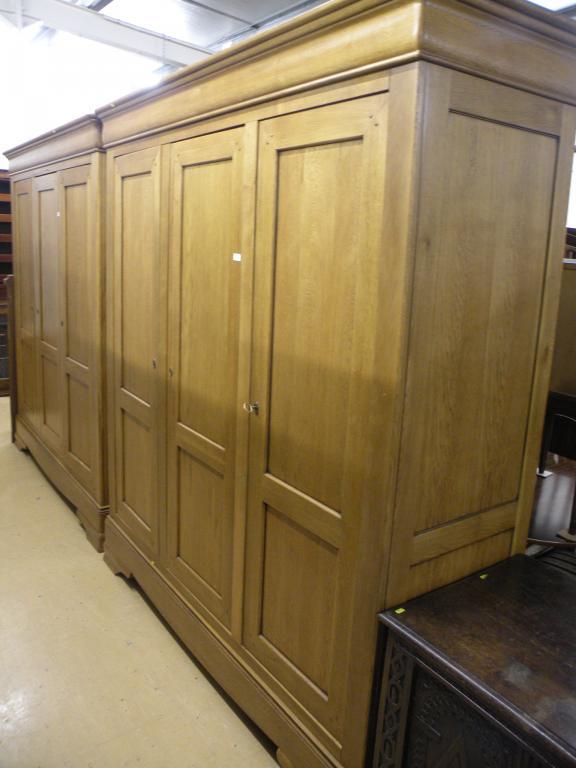 Appraisal: A French style triple wardrobe on bracket feet