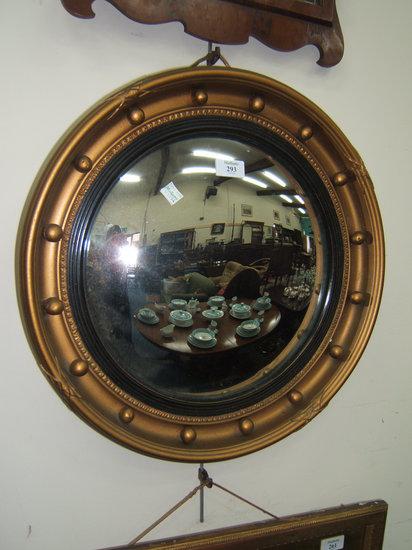 Appraisal: A circular gilt framed convex wall mirror diameter