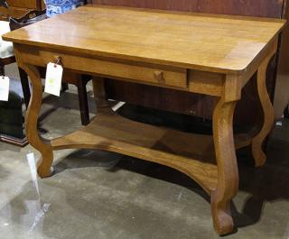 Appraisal: American oak library table having a rectangular top above a