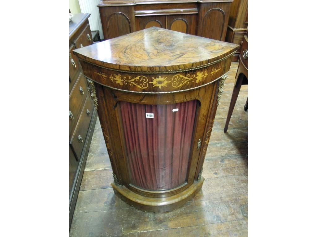 Appraisal: A Victorian walnut and figured walnut veneered bow fronted corner