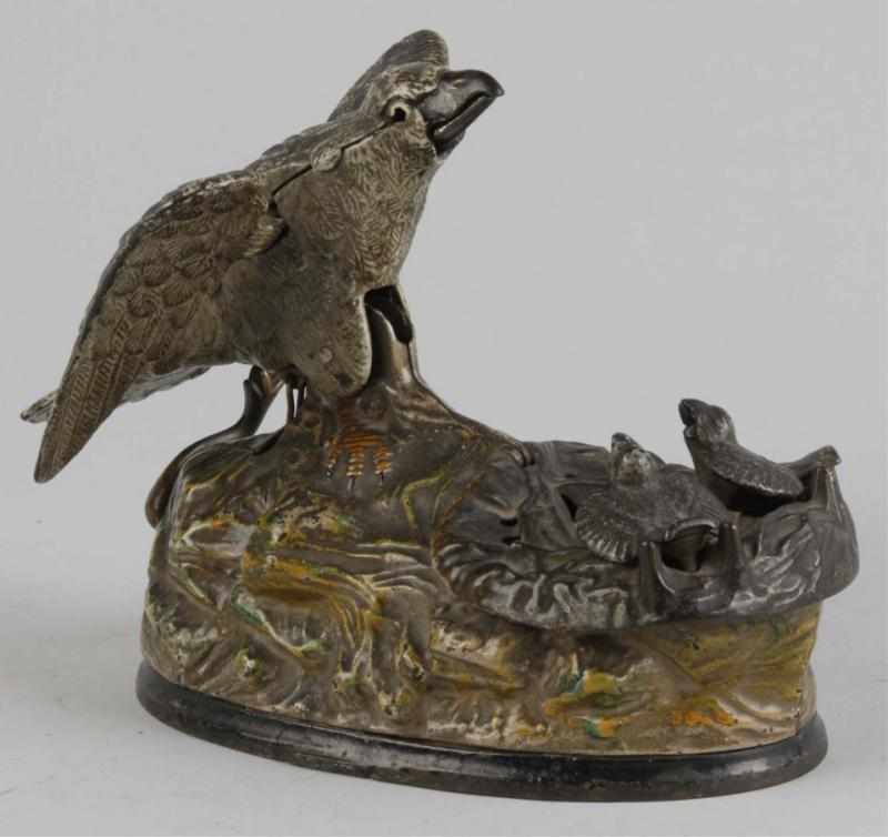 Appraisal: Cast Iron Eagle Eaglettes Mechanical Bank Description Manufactured by J