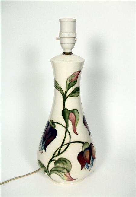 Appraisal: MOORCROFT LAMP BASE CIRCA glazed earthenware decorated in a fuchsia