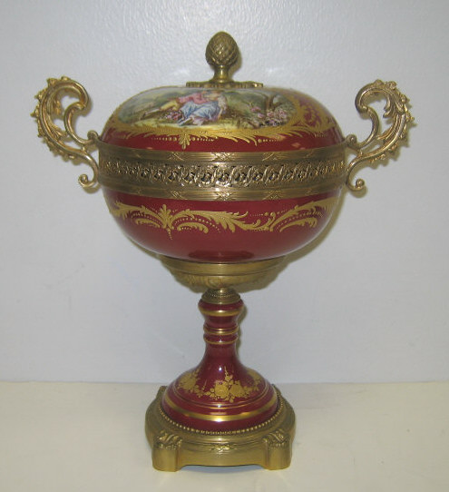 Appraisal: SEVRES STYLE LIDDED POT POURRI URN Gilt metal mounted burgundy