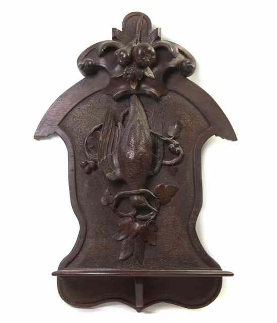 Appraisal: A Black Forest Carved Wall Bracket having a fruit form