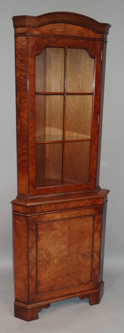 Appraisal: A thC Queen Anne style walnut veneered corner cabinet the