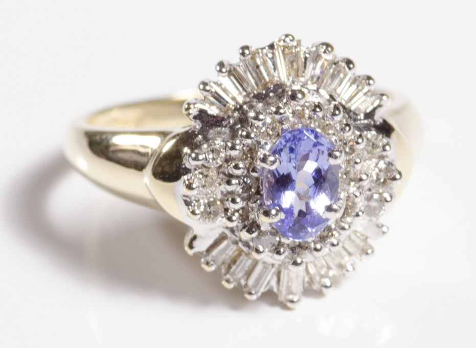 Appraisal: TANZANITE DIAMOND AND FOURTEEN KARAT GOLD RING with round-cut and