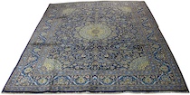 Appraisal: A Kashan Carpet This Kashan carpet features navy blue ground