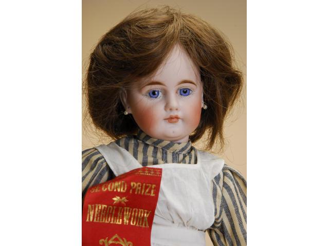 Appraisal: Early Belton Child Wearing Nurse Costume Germany ca solid dome