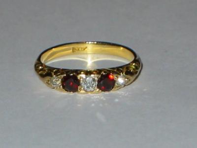 Appraisal: A VICTORIAN GARNET AND DIAMOND RING comprising two garnets and